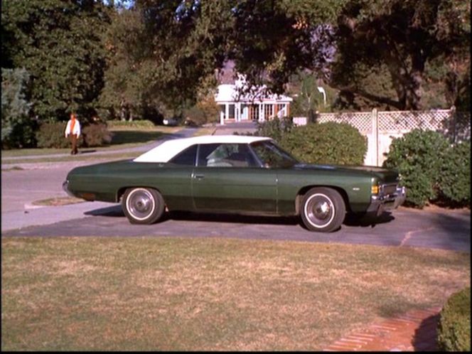 Here's a sequoia green 1972 Impala convertible parked in the Stephenses